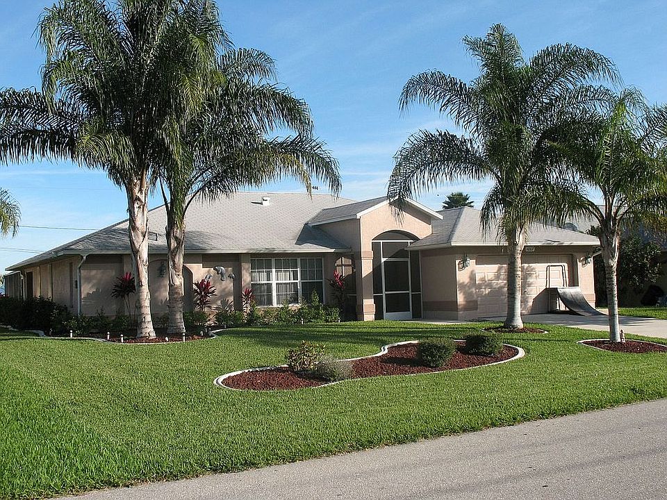 Front of House w/Mature Palms