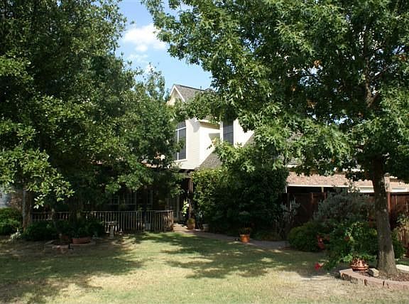 BACKYARD WITH MATURE TREES