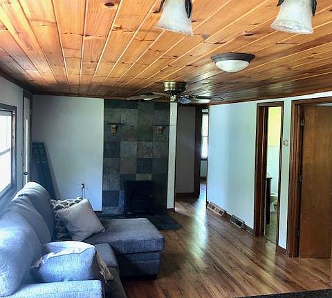 Living room with 2 bedrooms to right