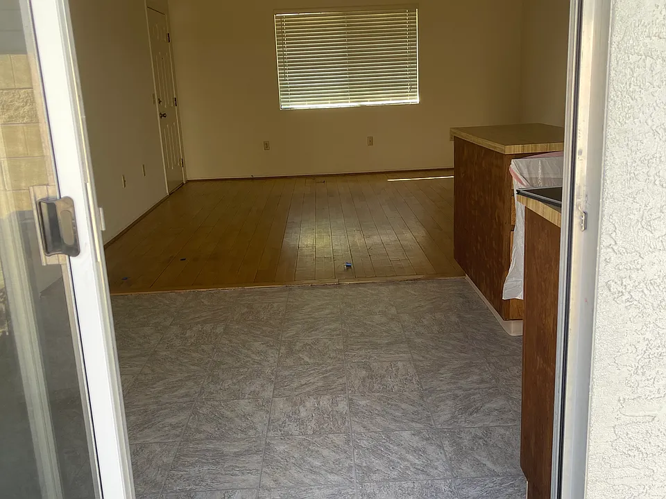 FROM PATIO VIEW OF DINING AREA OF KITCHEN & LIVING ROOM