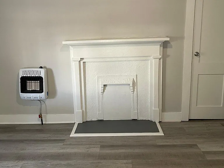 First bedroom facing street; new natural gas heater