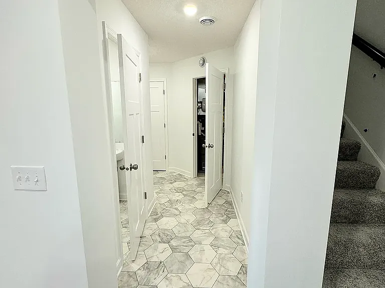 Lower level - HVAC room + Powder room walk-way