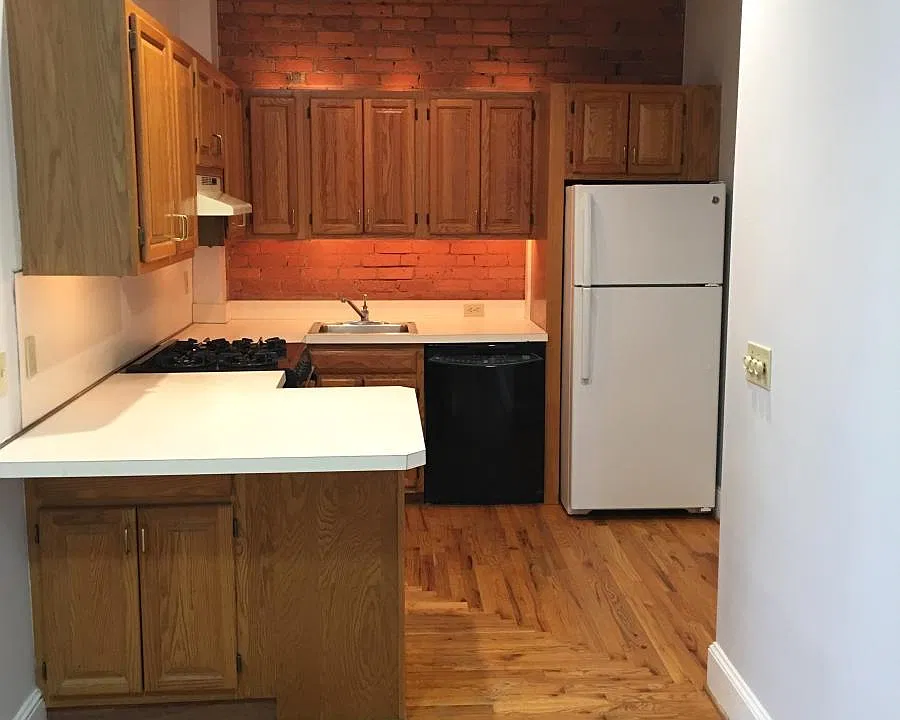 Backlit Kitchen with exposed brick + gas stove