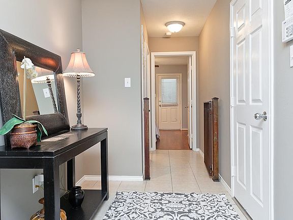 Inviting Entry has tile flooring, neutral paint and tons of natural light.