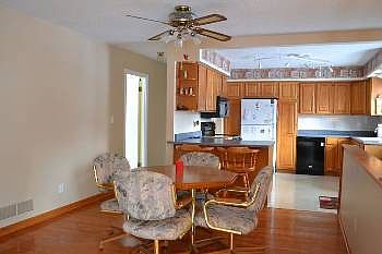 View of the large, very open concept dining area.  This space opens up to the kitchen as pictured, but also opens up to the living area to the back of the picture.  