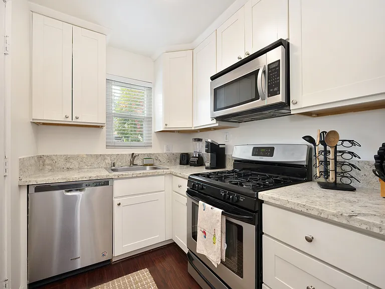 Updated kitchen with dishwasher and gas stove
