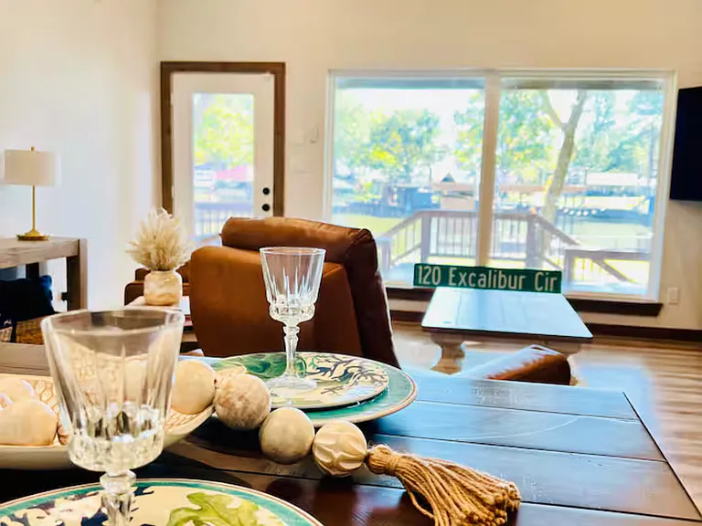 Stylish dining area with a high-top table for 4, plus 4 bar stools at the kitchen counter_perfect for casual meals and socializing.