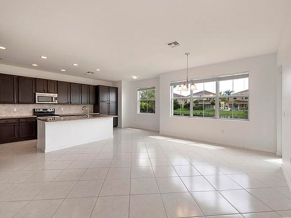 FACING FAMILY ROOM, KITCHEN & WATER VIEW