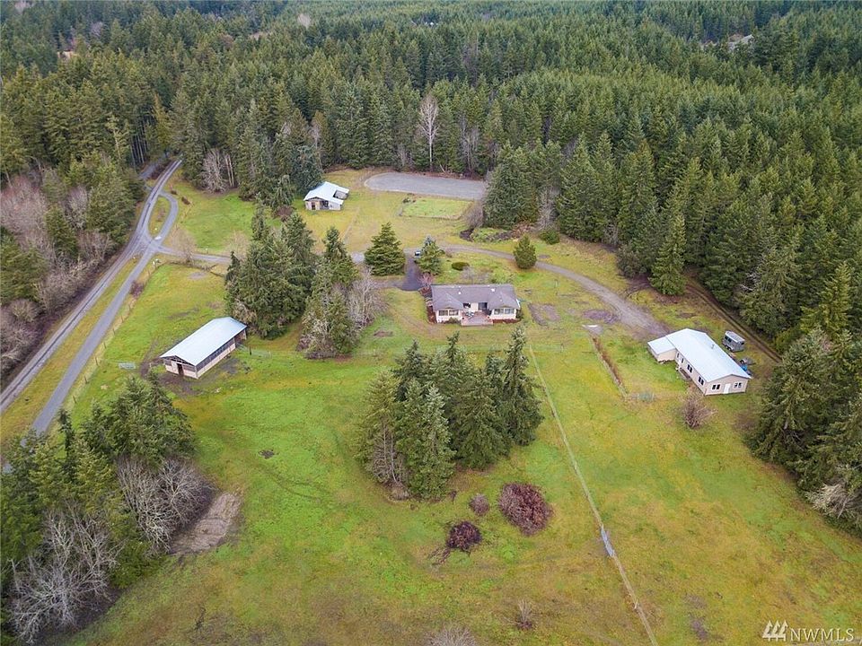 This property is fenced and crossed fenced, all buildings have water and power.  Larry Scott Trail is on the left and the railroad grade is on the right in the trees.  More to this property than meets the eye.  Located close to Port Townsend within a neighborhood of acreage parcels and a private without seeing any buildings but your own.  Southern exposure for great gardening, great light, and warmth.