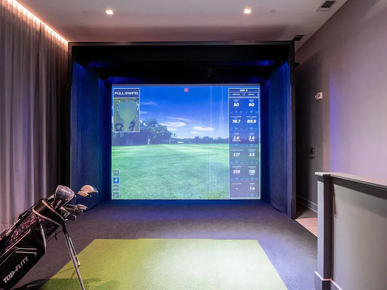 Golf Practice Bay Featuring Hitting Mat and Virtual Course Projection