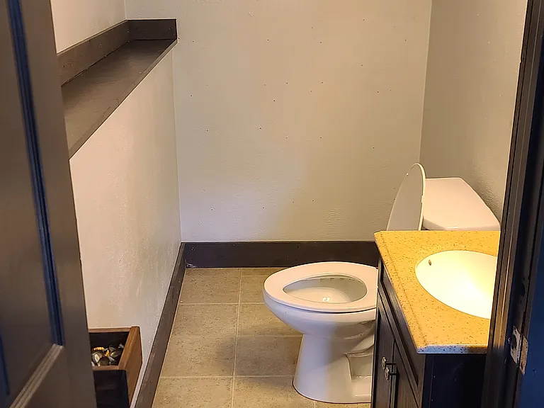 Half bathroom next to Bar/recreation area and family room