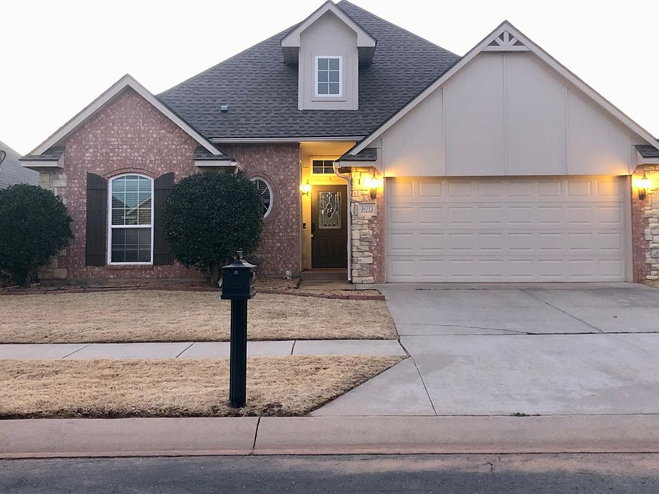 Brick and stone house in gated community.