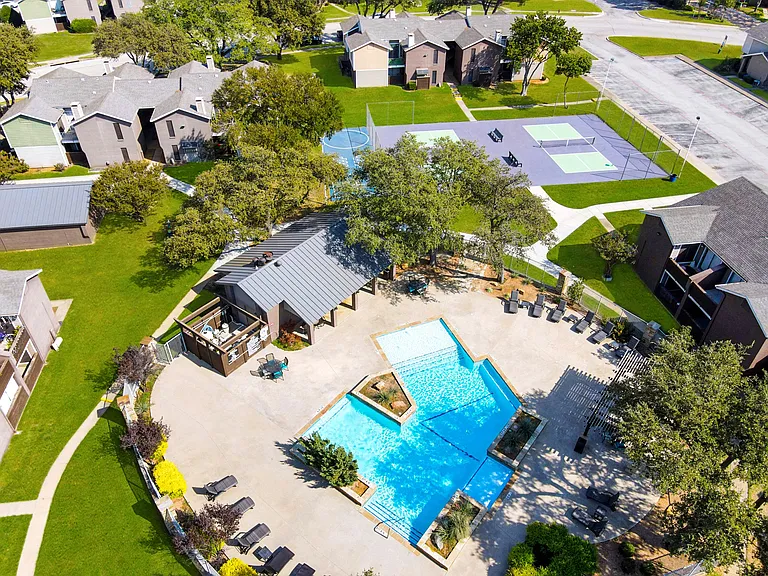 See it allour pool, sport courts, and lush landscaping from above.