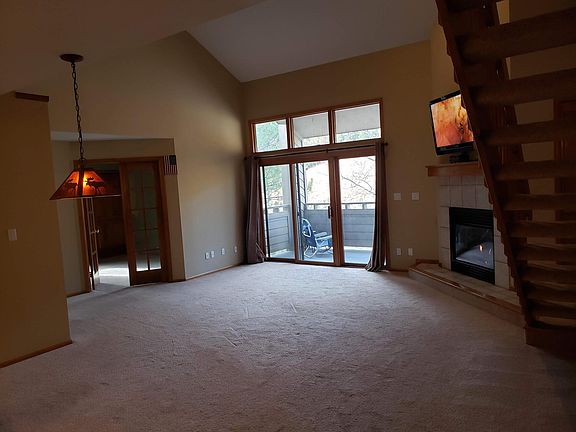 Main living area with high vaulted ceiling