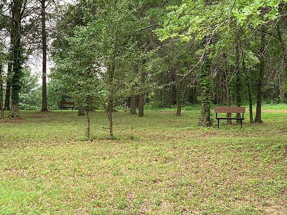 Community has two fire pits and a fully stocked pond with walking trail.