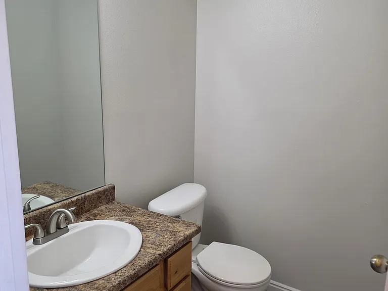 bathroom downstairs by living and kitchen area