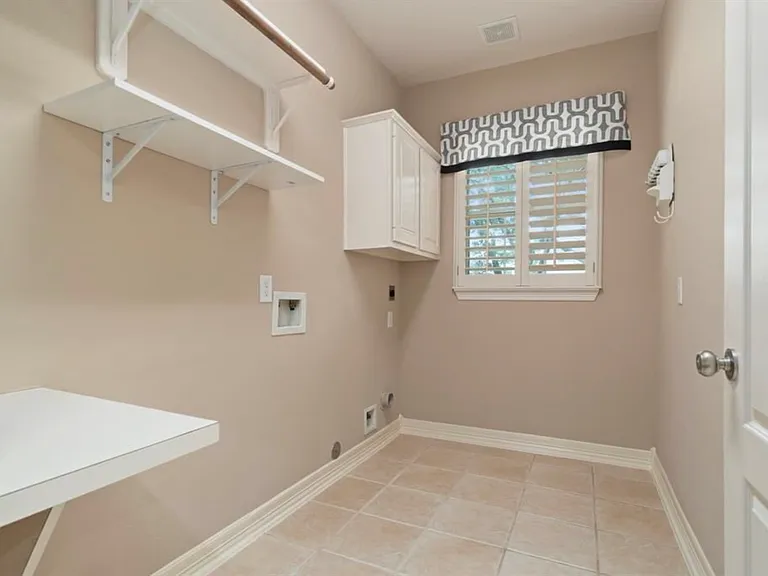 Laundry room. Has washer and dryer with WiFi capability.