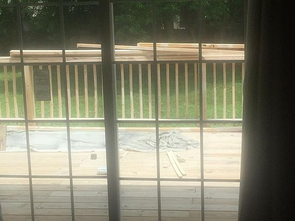 View of back yard / deck from LR (building excess supplies r