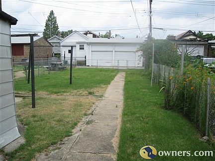 View of fenced in back yard