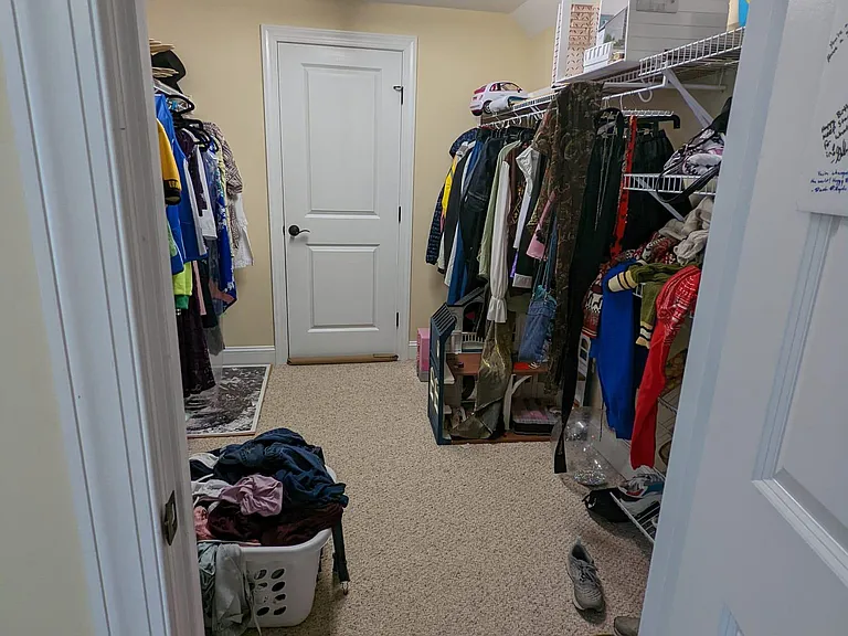Wall-in closet for upstairs bedroom #1.