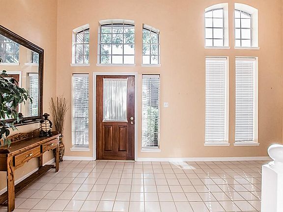 This large foyer welcomes you into the spacious and warm interior of this home.