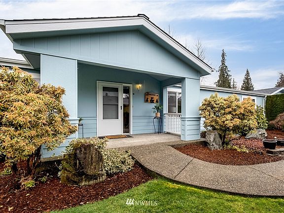 Entryway with no stairs to navigate and a covered front porch.
