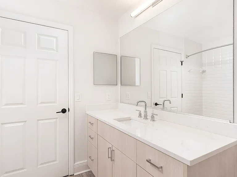 Large vanity and ample lighting in your new bathroom