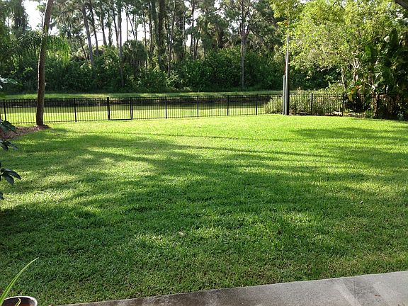 Spacious back yard backing up to canal