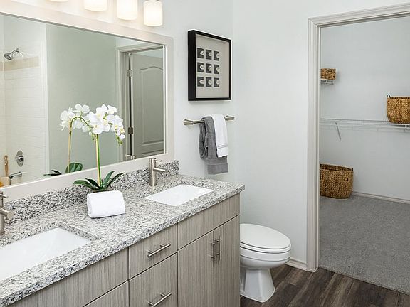 Bathroom upgrades include double vanities, undermount sinks and premium granite countertops