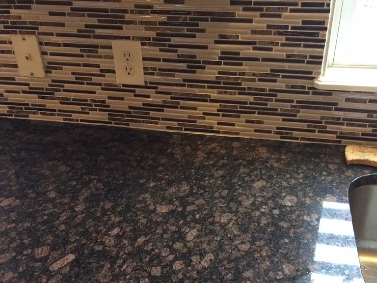 granite and backsplash in kitchen