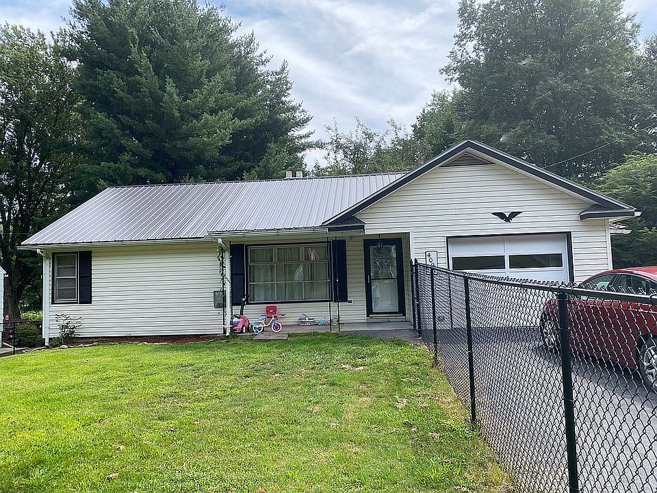 Front with fenced yard