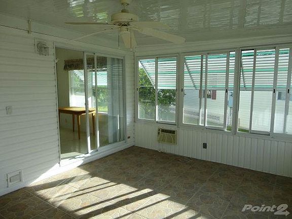 Glass enclosed front lanai with a/c unit