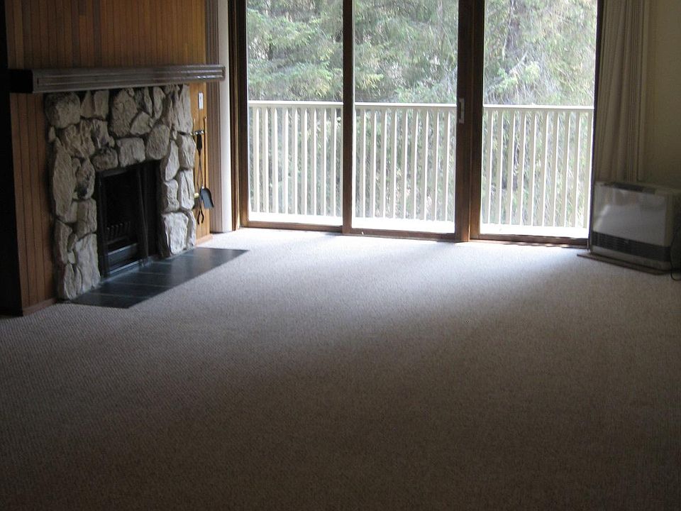 living room w/fireplace & small balcony