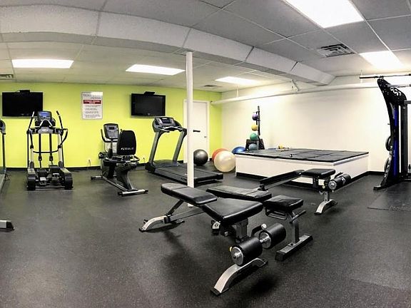 Workout room is adjacent to laundry room