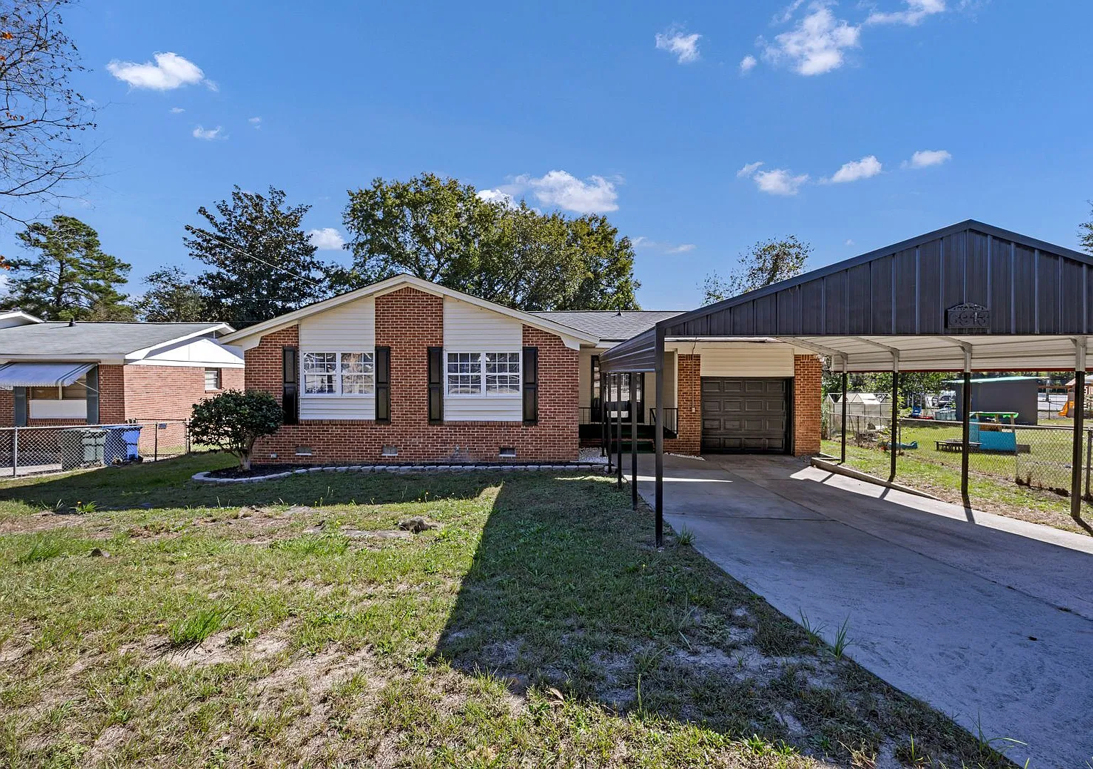Comfortable 3-Bedroom Home Featuring Garage, Carport & Fenced-In Yard — Photo 1