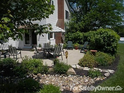 Rock bed adds depth and new maple tree provides shade in the evenings.