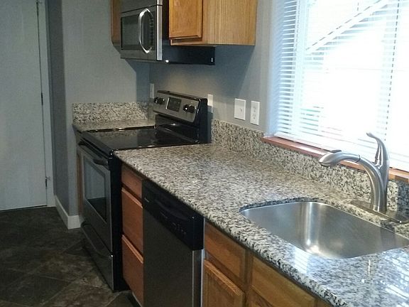 Galley Kitchen with Granite