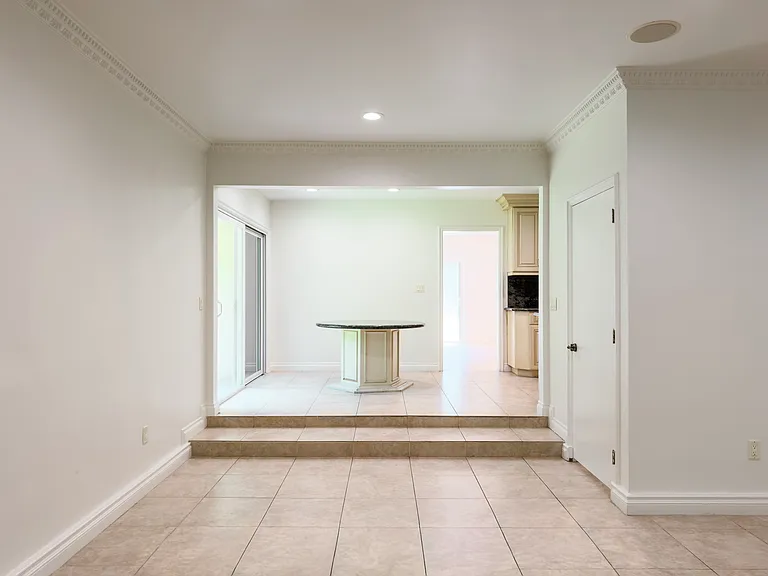 Sunken breakfast nook off the kitchen with tile flooring adds charming everyday dining to this Beverly Hills luxury rental at 1094 Garden Lane, a 90210 home for rent.