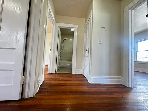 Well-designed layout featuring three comfortable bedrooms connected to a shared full bathroom, offering convenience and easy access for all occupants, making it ideal for families or shared living arrangements while maintaining privacy and efficiency.