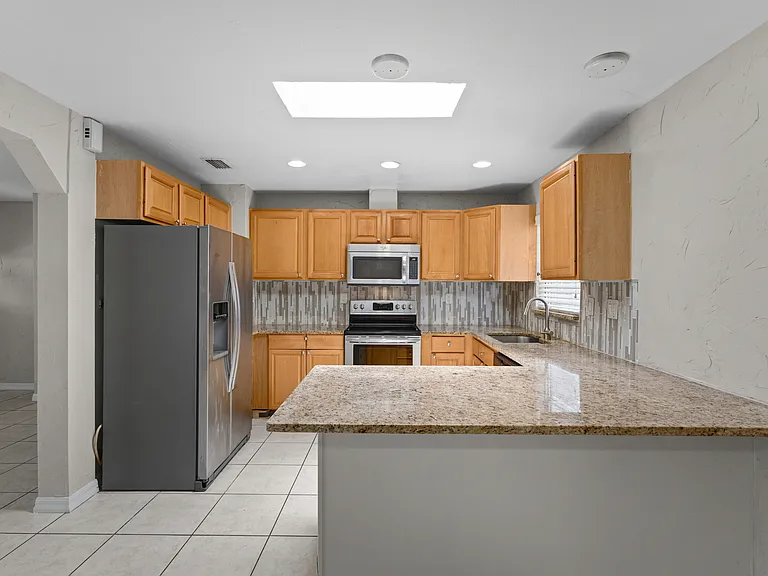 Kitchen with counter eating area
