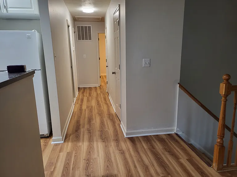 upstairs hallway to full bathroom & 3 bedrooms (master bedroom with additional full bathroom)