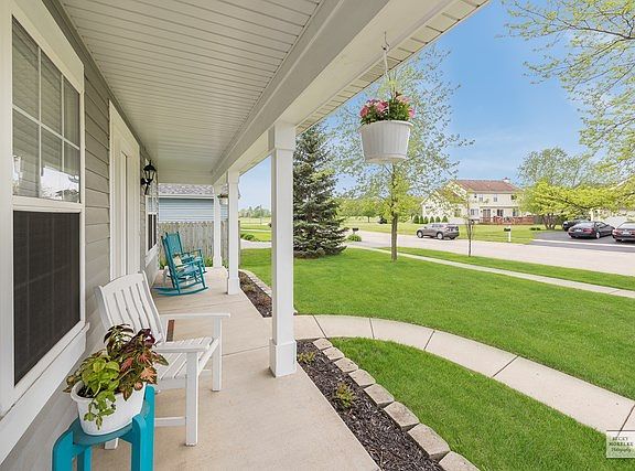 ATTRACTIVE CURB APPEAL AND FULL WELCOMING PORCH.