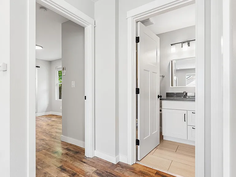 Hall Bath and Door to Primary Bedroom