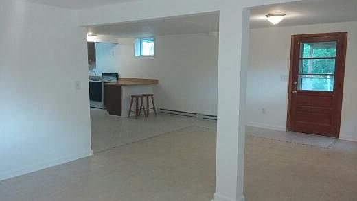 Living Room with view of Dining/Kitchen area.