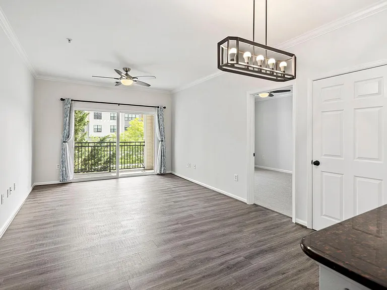 Living room space freshly painted. Curtains are optional.
