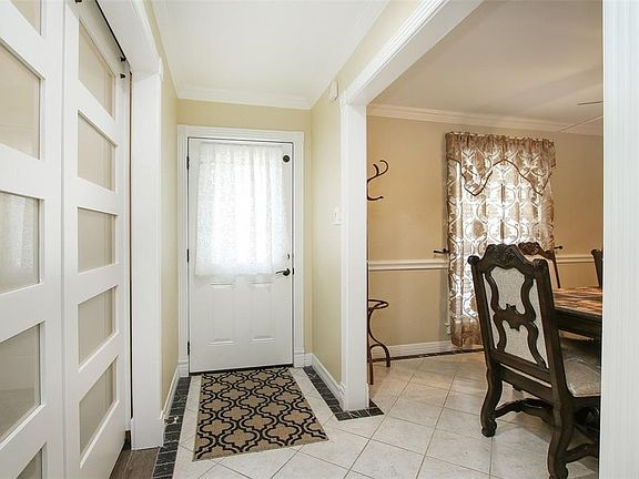 Standing in the hall looking at the front door.