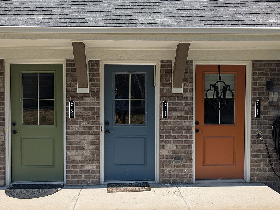 Blue door in middle is the condo entrance if you aren't entering through the garage.
