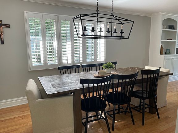 Dining room table leading into the living room