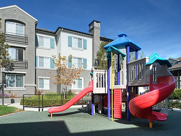 Playground next to apartment building.