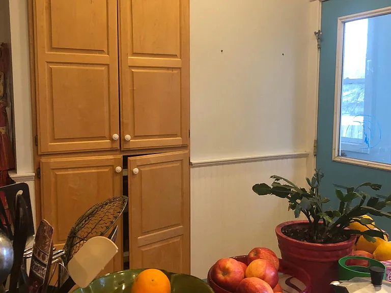 Kitchen island with large pantry cabinets